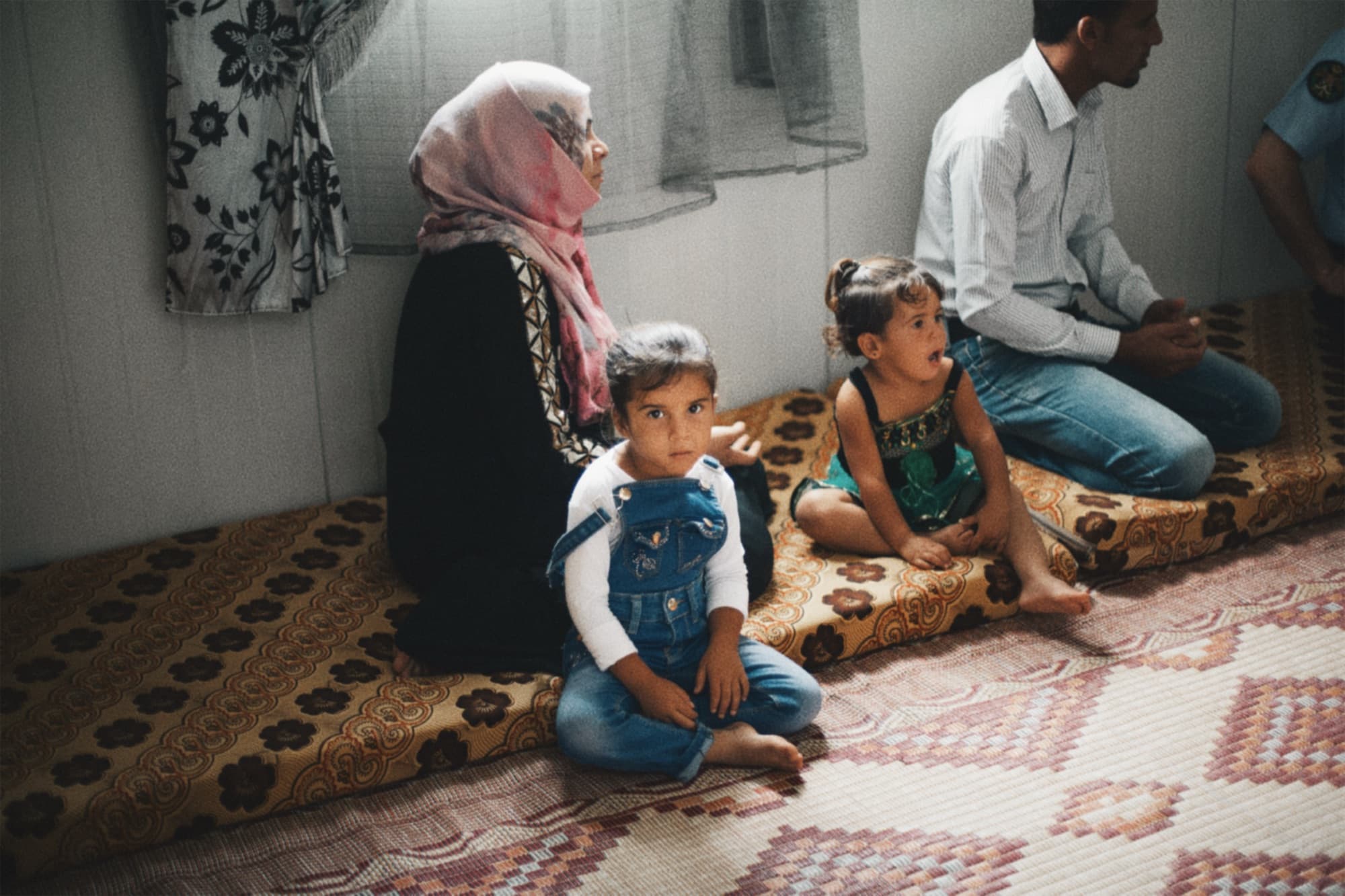 Adults and children seated together during a visit