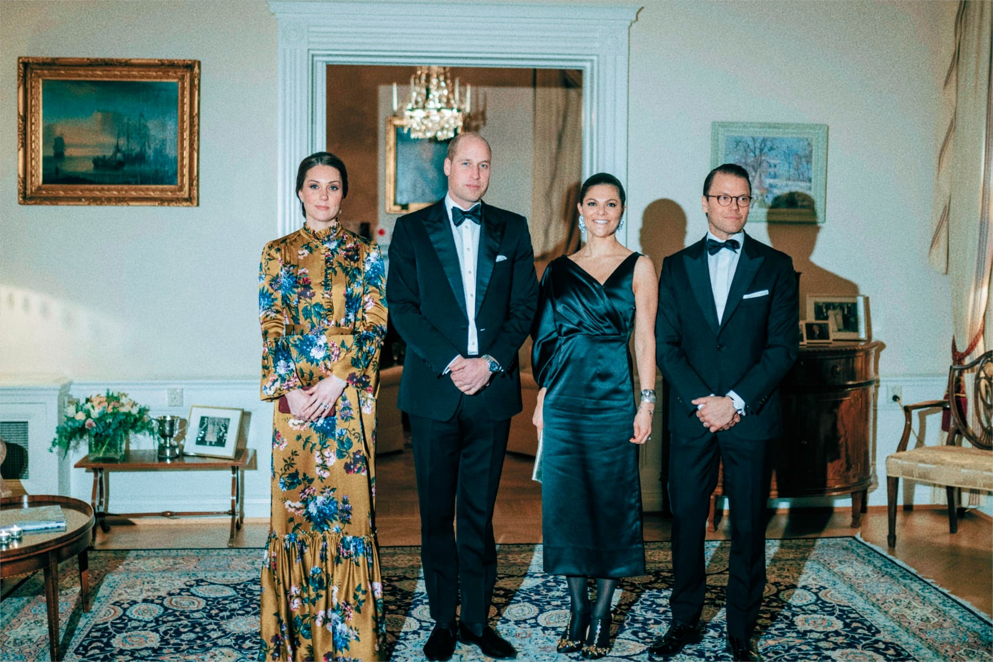 Four guests posing together in formal evening wear