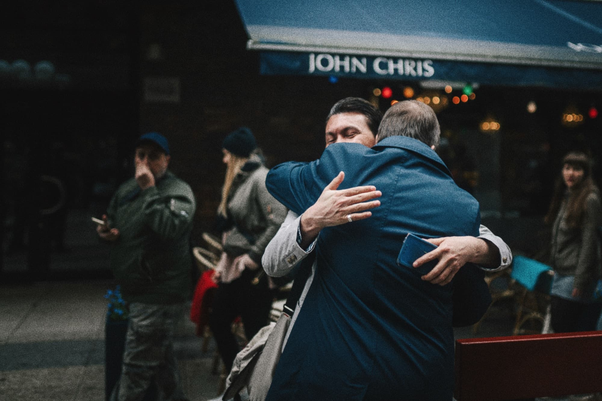 Two people embracing on a street