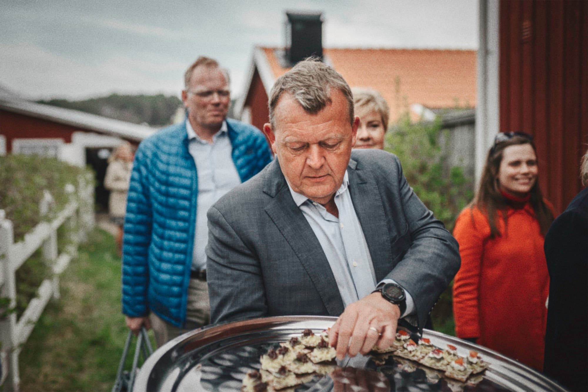 A man examining an oyster display during a visit